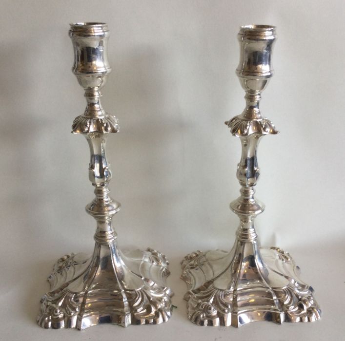 A good matched pair of George III cast silver cand