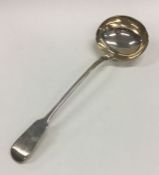 A large Victorian silver soup ladle. London 1858.