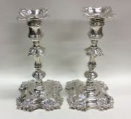 A pair of Georgian cast silver candlesticks of typ