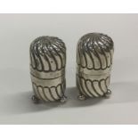 A pair of Edwardian silver fluted peppers. Birming