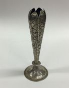 A Persian silver vase decorated with flowers and l