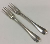 A good pair of George I silver three prong forks.