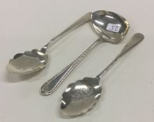 A pair of silver mounted preserve spoons together