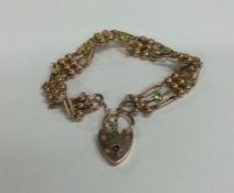 A heavy 9 carat and peridot bracelet with heart sh