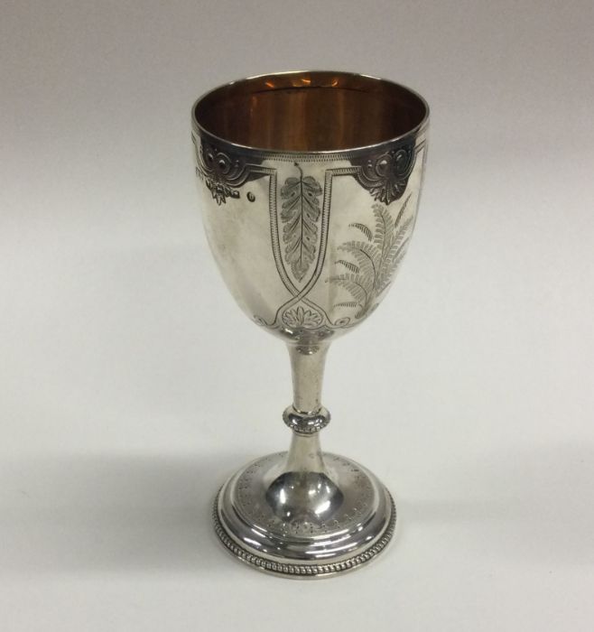 A Victorian silver engraved goblet with floral dec