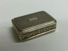 A silver gilt vinaigrette with engraved floral gri