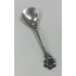 A Japanese silver spoon of stylised form. Approx.