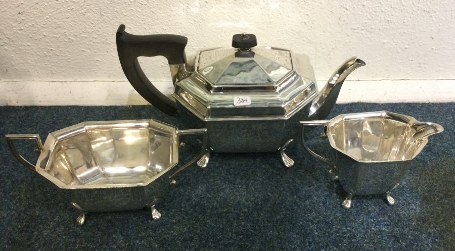 A good quality three piece silver panelled tea set