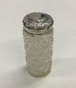 A small silver mounted hobnail cut jar and cover.