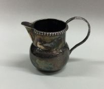 An attractive miniature Edwardian silver cream jug