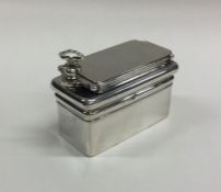 A heavy rectangular silver travelling inkwell with