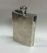 A heavy engine turned silver hip flask of shaped f