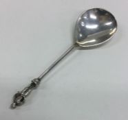 A heavy cast silver spoon with stepped decoration.