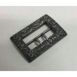 A heavy cast Indian silver buckle of typical form.