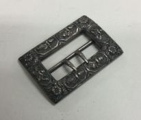 A heavy cast Indian silver buckle of typical form.