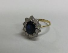 An 18 carat gold sapphire mounted cluster ring in