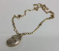 A 9 carat locket on fine link chain. Approx. 8 gra