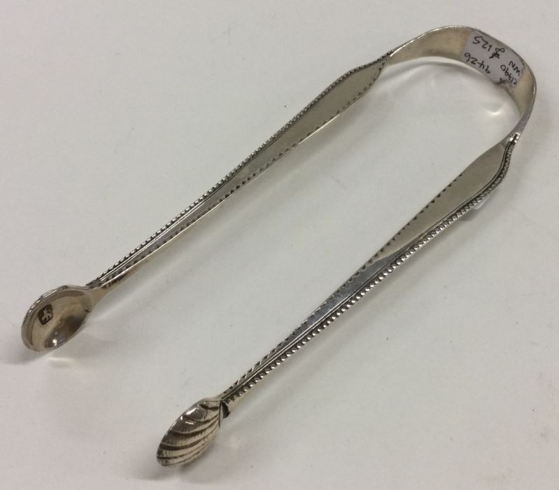 A pair of unusual silver sugar tongs with beaded e - Image 2 of 2