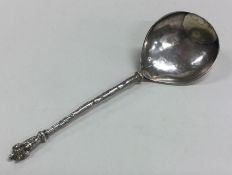 A large Antique silver spoon with textured decorat