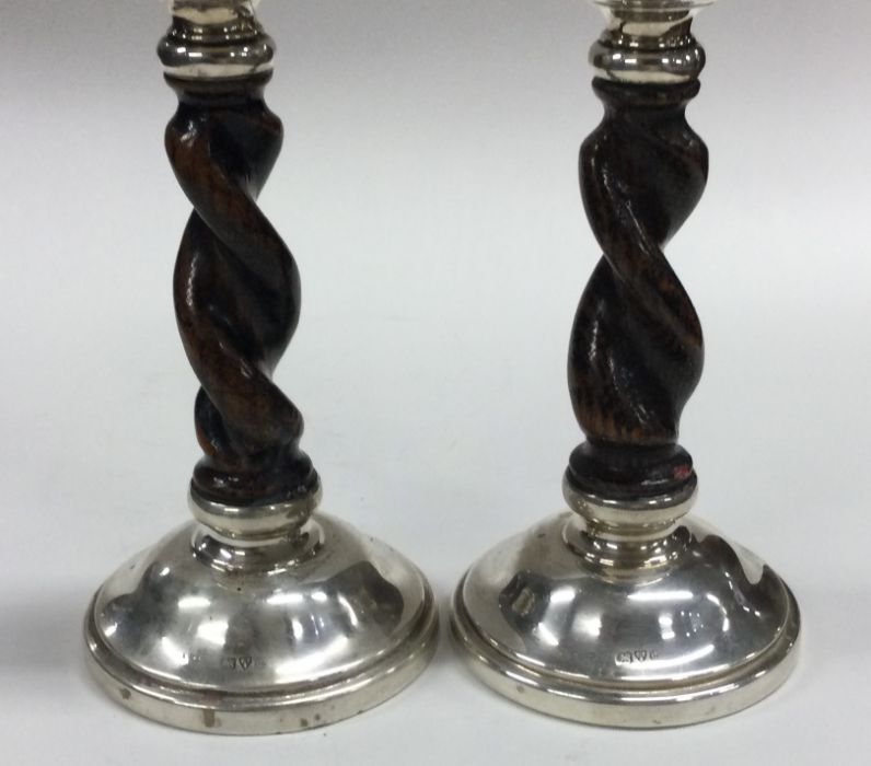 A good pair of oak and silver mounted candlesticks - Image 2 of 2