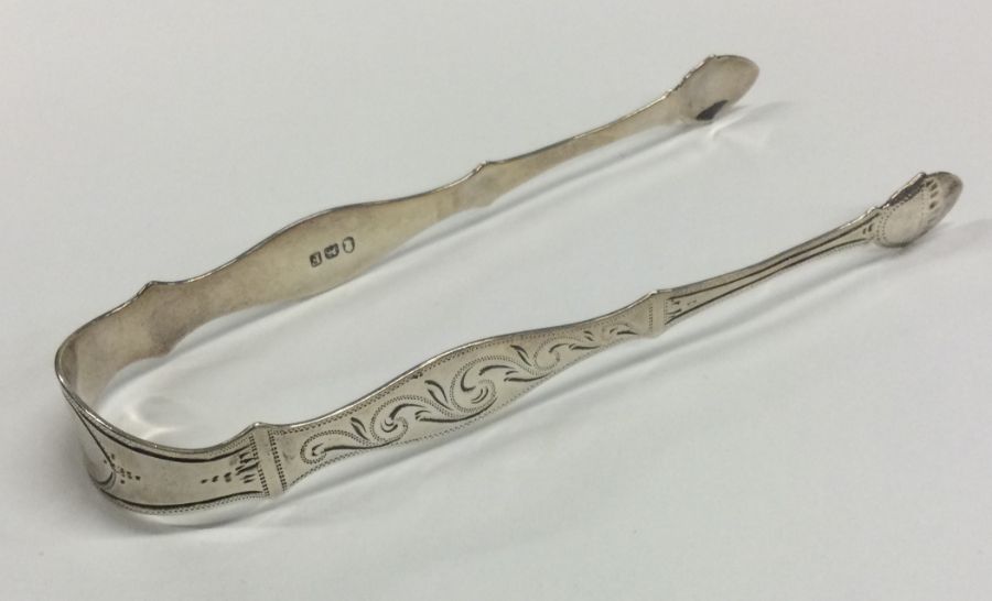 A pair of George III bright cut silver sugar tongs