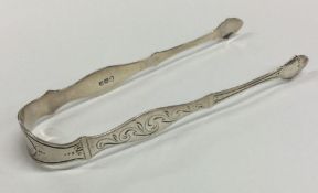 A pair of George III bright cut silver sugar tongs