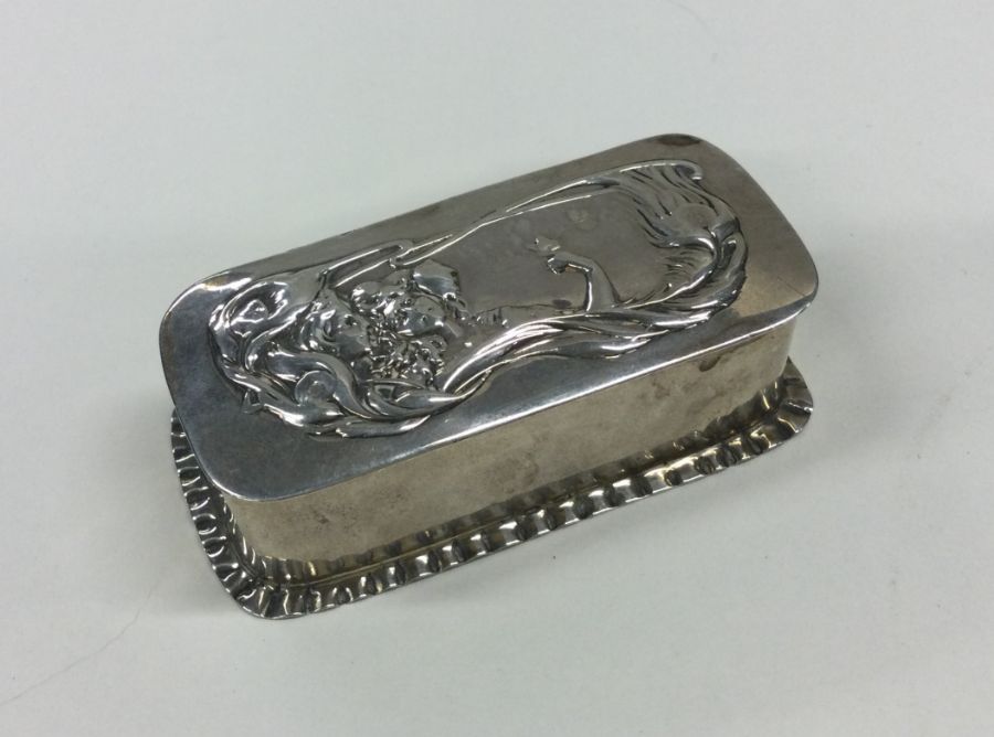A small rectangular Art Nouveau silver box with cr
