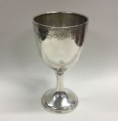 An attractive engraved silver goblet decorated wit