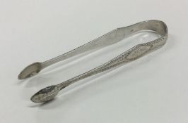 A good pair of bright cut silver sugar tongs. Lond