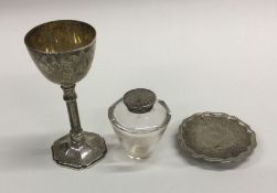 An unusual cased silver travelling communion set.