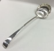 A large George III silver fluted soup ladle with f