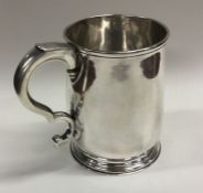 A good Georgian silver baluster shaped pint mug of