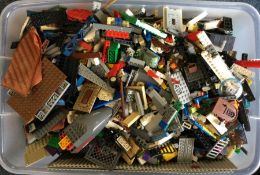 A large box containing Lego bricks of varying colo