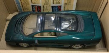 A boxed 1:12 scale diecast MAISTO Jaguar XJ220 (19