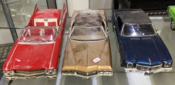 Three diecast models of toy cars of varying makers