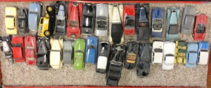 A collection of diecast and other toy cars of vary