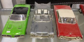 Three diecast models of toy cars of varying makers