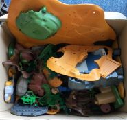 A box containing Playmobil landscapes, scenery and