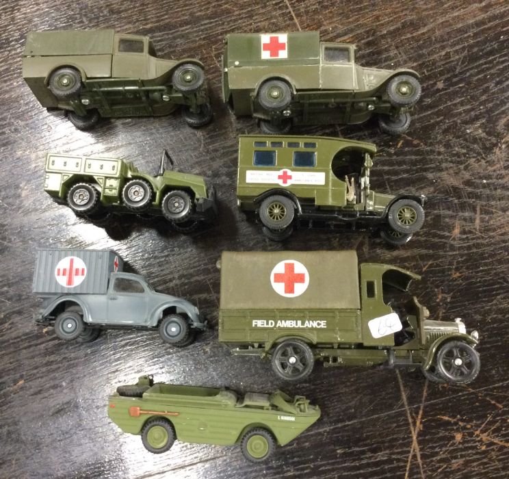 CORGI: A diecast toy army truck together with othe