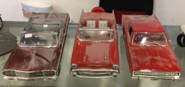 Three diecast models of toy cars of varying makers
