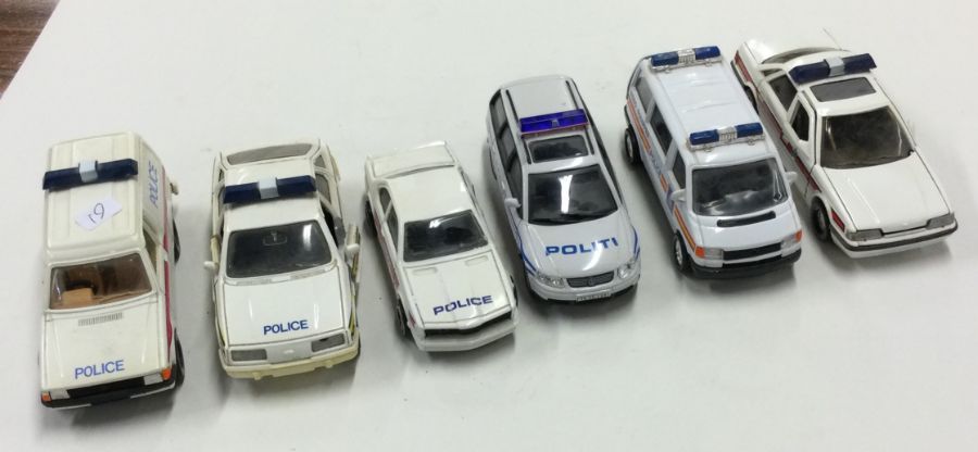 CORGI: A toy Ford Escort police van together with