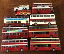 A collection of diecast toy buses and coaches of m