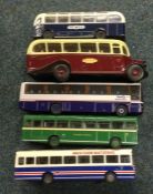 A collection of diecast toy double decker buses of