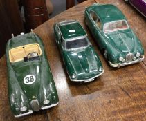 Three diecast models of 'Jaguar' cars of varying m