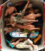 A box containing a quantity of Action Men and othe