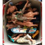 A box containing a quantity of Action Men and othe