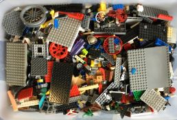 A large box containing Lego bricks of varying colo