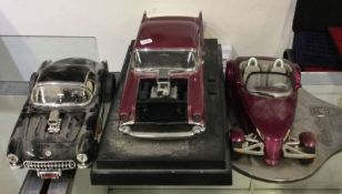 Three diecast models of toy cars of varying makers