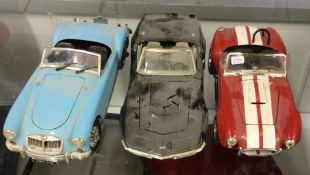 Three diecast models of toy cars of varying makers