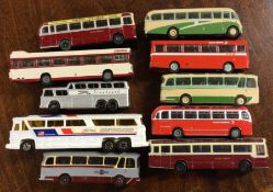 A collection of diecast toy buses and coaches of m